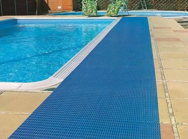 Premium swimming pool mats installed around a swimming pool